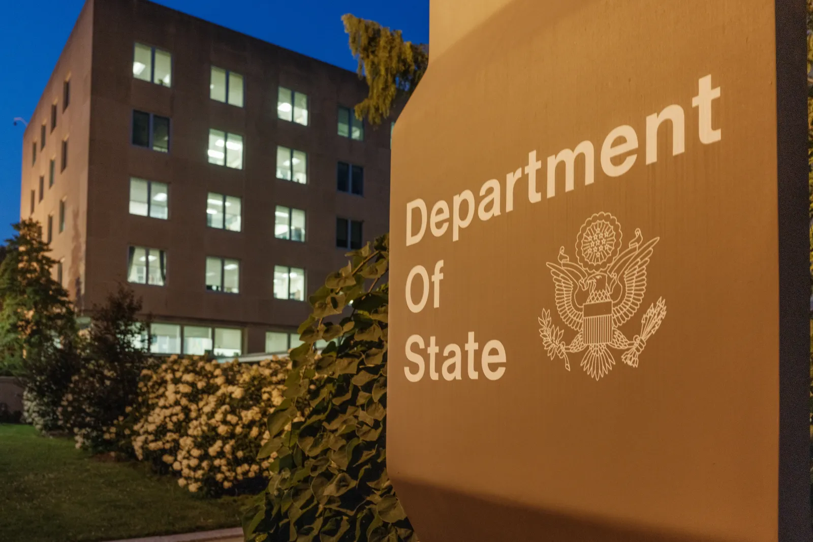 Office lights are illuminated in the U.S. Department of State headquarters building at dusk on July 11, 2025, in Washington, D.C.