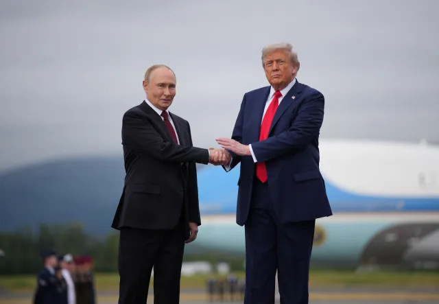 U.S. President Donald Trump greets Russian President Vladimir Putin in Anchorage, Alaska, on August 15, 2025.