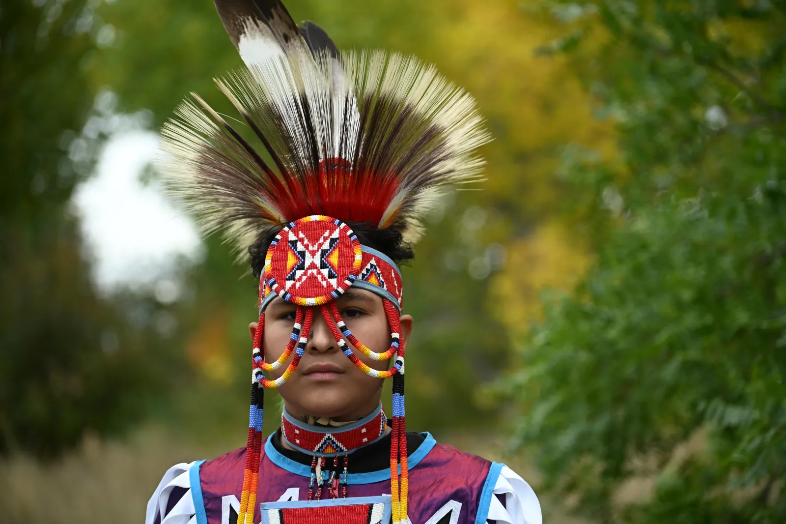 Jacob Gonzales, 14, with Navajo and Apache heritage, poses for a portrait during a ceremony to commemorate Indigenous Peoples' Day on October 13, 2025, in Denver.