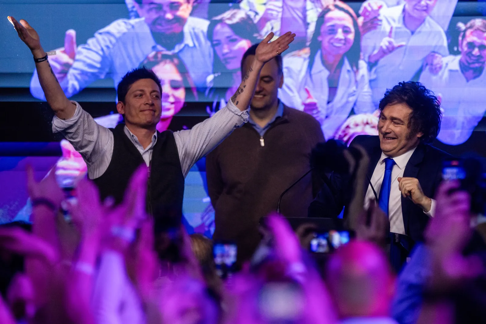 Javier Milei (R), and Presidential Adviser Santiago Caputo celebrate after the midterm elections on October 26, 2025 in Buenos Aires.