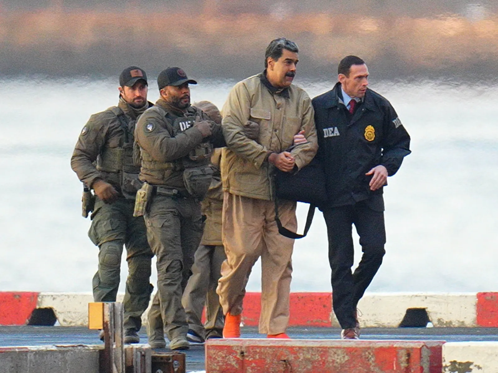 Former Venezuelan President Nicolás Maduro and former first lady Cilia Flores are escorted by federal agents after arriving in New York on January 5, 2026. U.S.