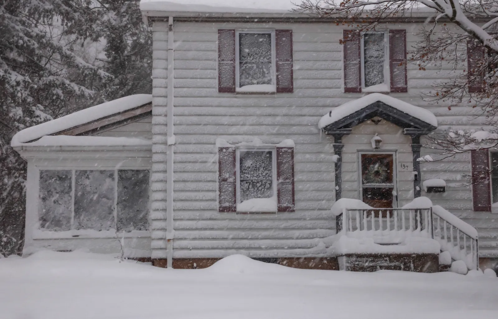 Houses are covered by snow on February 23, 2026 in Norwood, New Jersey.