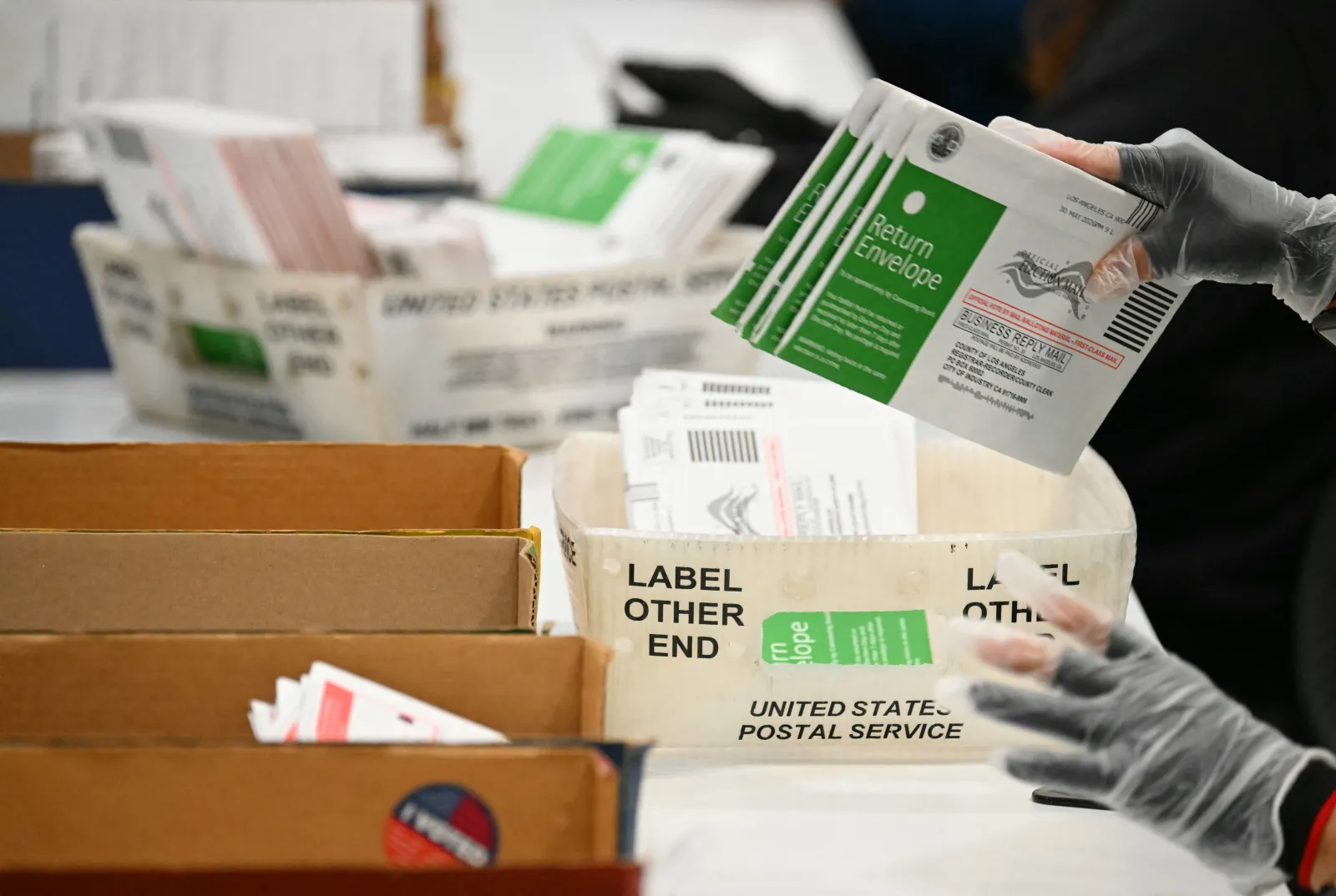 Mail-in ballots are processed at the Los Angeles County Ballot Processing Center during California's primary election on June 2.