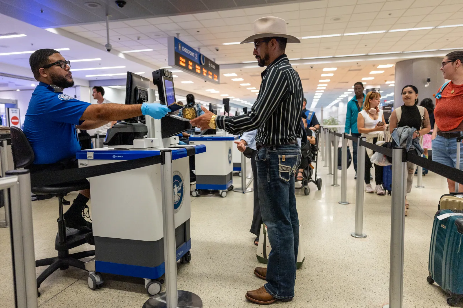 Marvin Suazo, 43, passes through a TSA checkpoint at Miami International Airport on May 25, 2026, while self-deporting to Honduras.