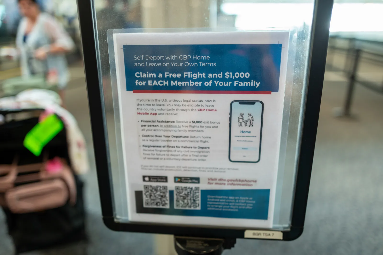 An information sign about self-deportation at a TSA checkpoint in Bangor, Maine, on June 13, 2026.