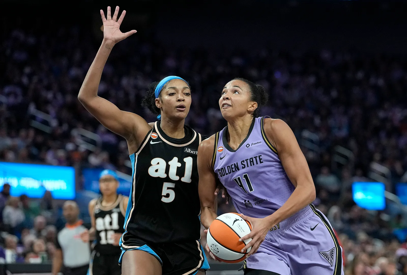 Atlanta Dream star Angel Reese defends against Valkyries star Kiah Stokes