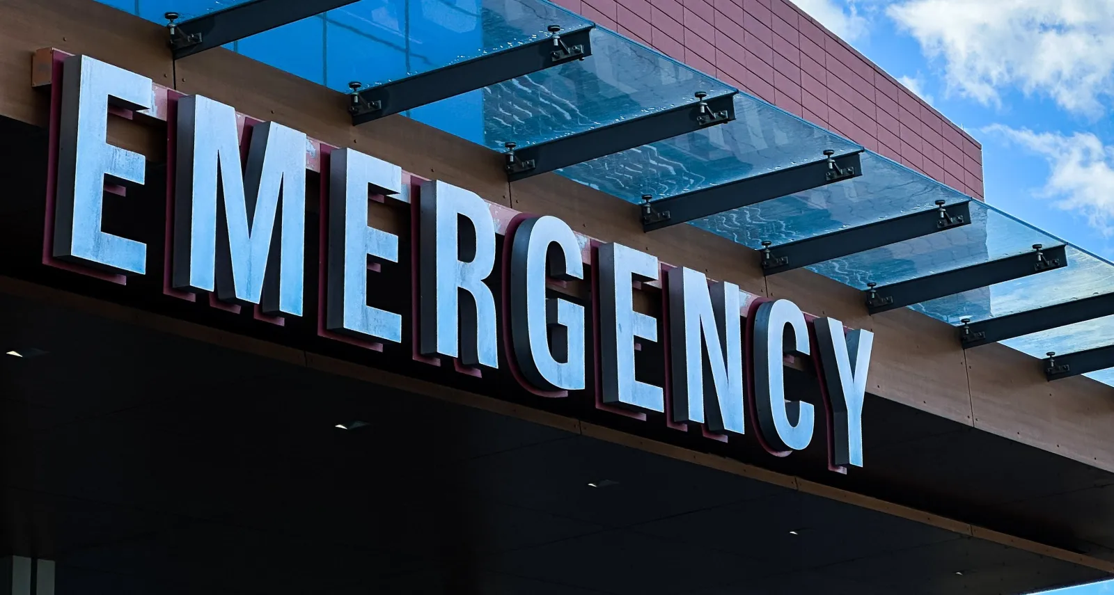File photo: Stamford, CT, USA - June 26, 2026: Emergency sign illuminated on a modern hospital building providing healthcare services