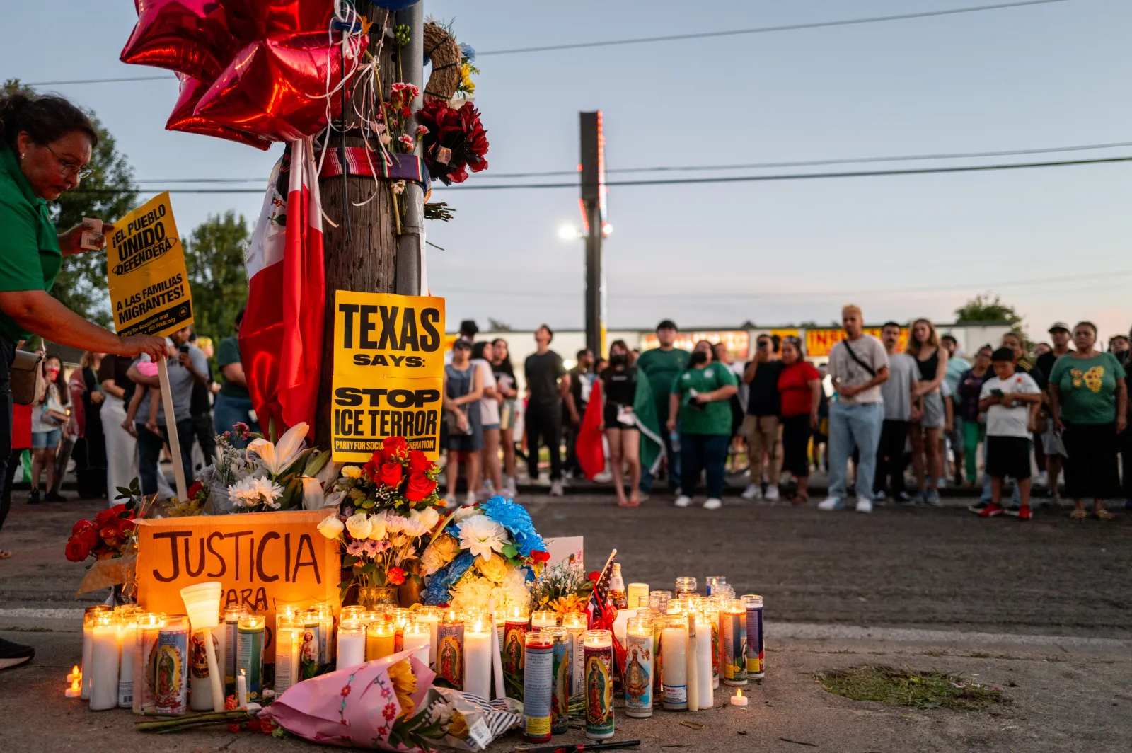 People pay their respects during a candlelight vigil at the site where Mexican immigrant Lorenzo Salgado Araujo was killed on July 08, 2026, in Houston, Texas. (Photo by Brandon Bell/Getty Images)
