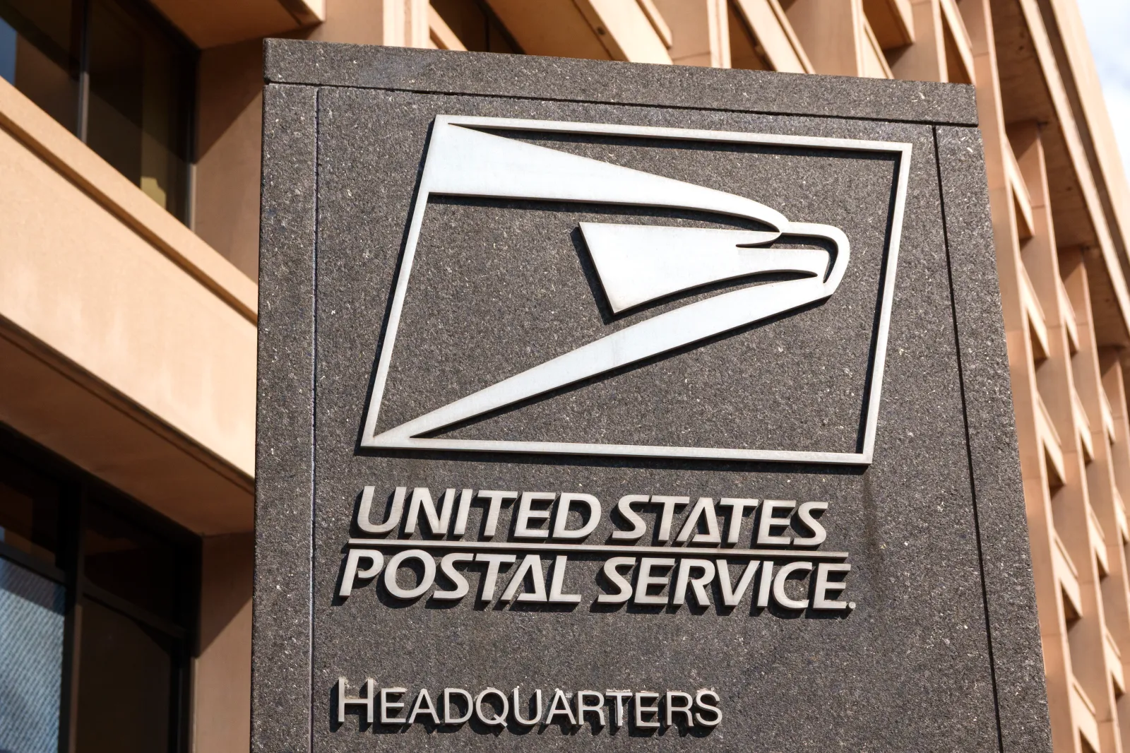 The United States Postal Service logo is displayed outside the agency's headquarters.