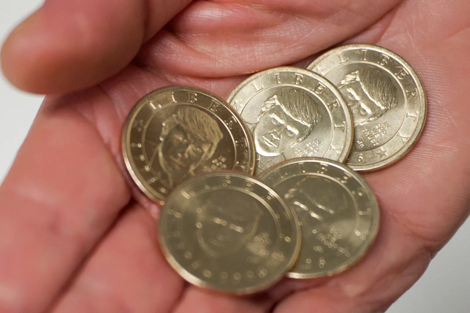 File photo: A person holds the 2026 Semiquincentennial President Donald J. Trump $1 coins in Washington, D.C., on September 3, 2026.