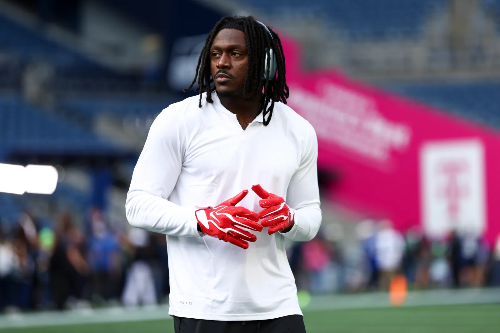 Patriots wide receiver AJ Brown warms up ahead of season debut against Seattle Seahawks