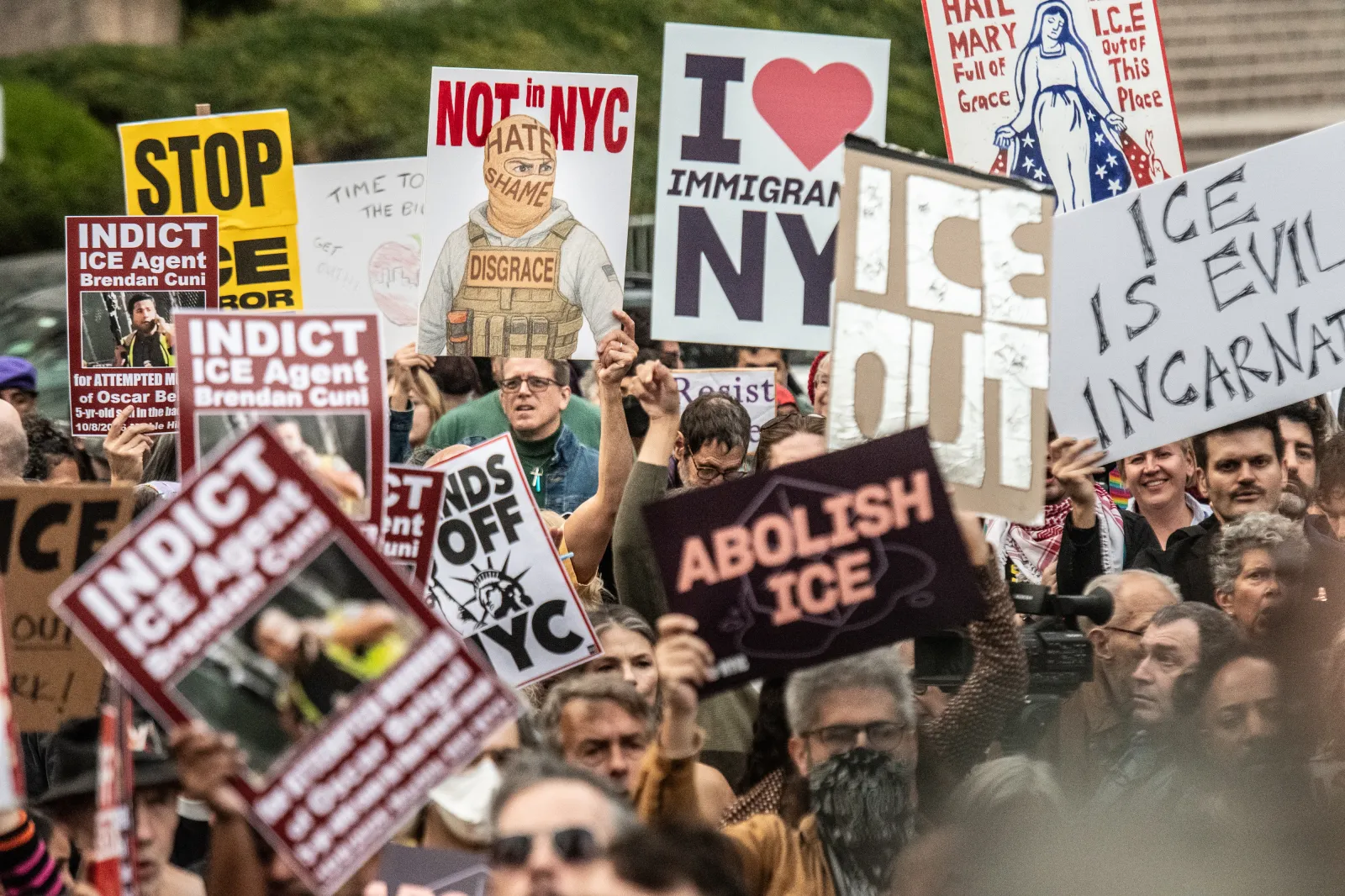 People participate in a march against Immigration and Customs Enforcement (ICE) activities on October 9 in New York City.