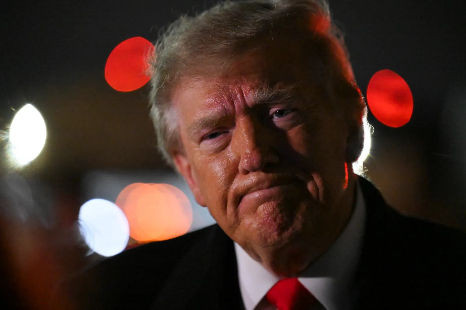 President Donald Trump speaks to members of the press after landing on October 10, 2026 at Joint Base Andrews, Maryland.