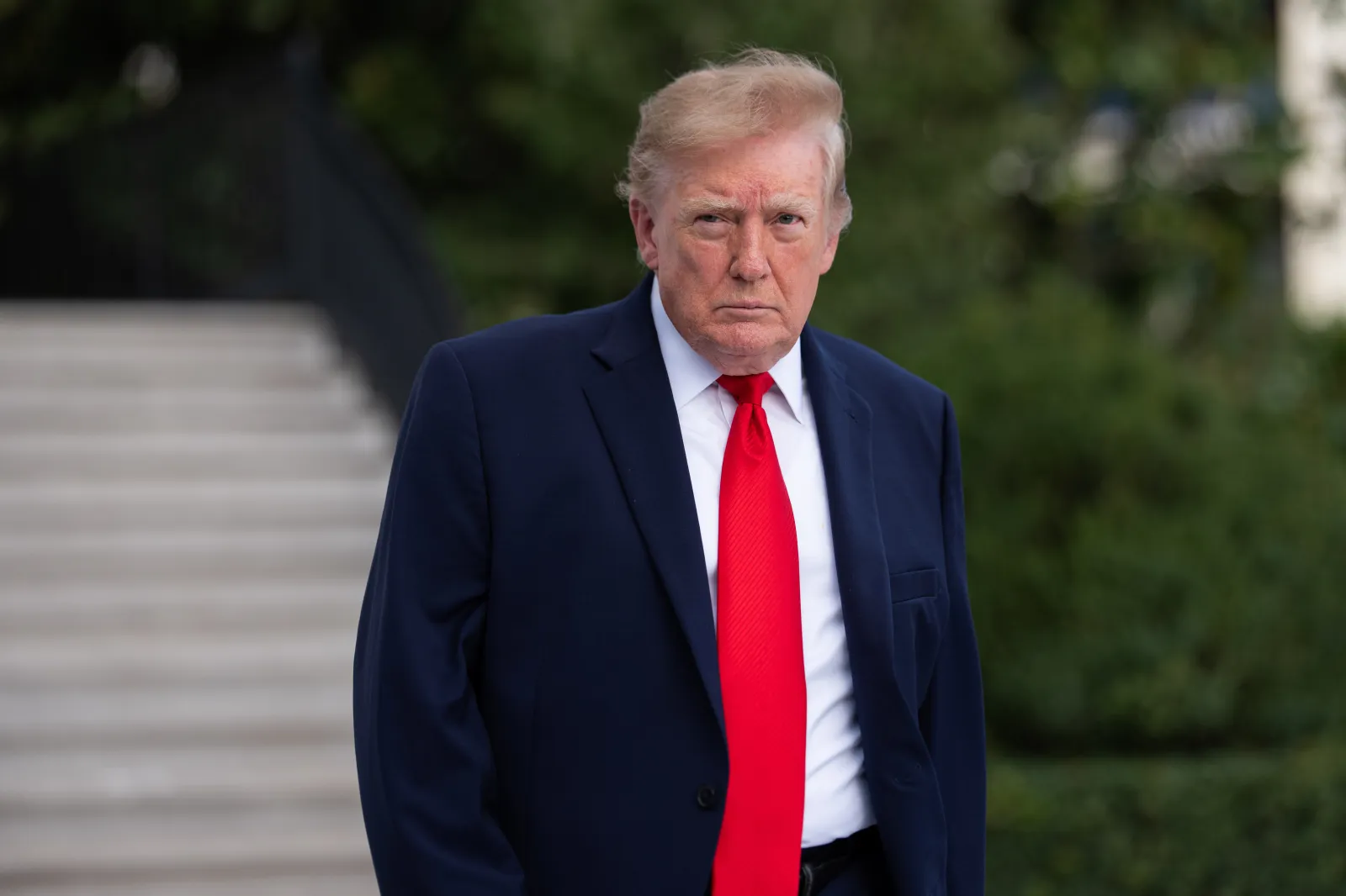 U.S. President Donald Trump walks on the South Lawn as he departs the White House on October 12, 2026 in Washington, DC.