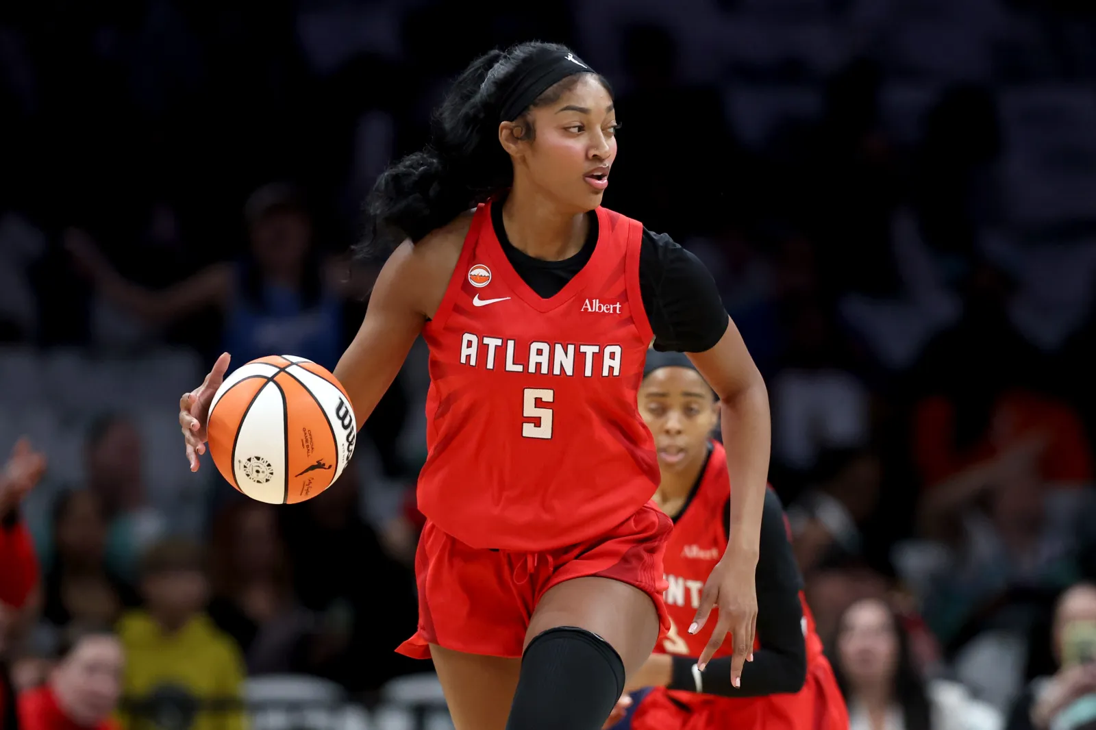 Atlanta Dream star Angel Reese brings basketball up court against New York Liberty