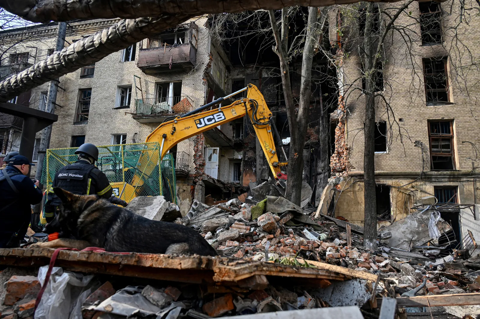 Ukrainian rescuers work to clear rubble as they operate at the site of an apartment building in Kharkiv on October 13, 2026. (Photo: Sergey Bobok/AFP via Getty Images)