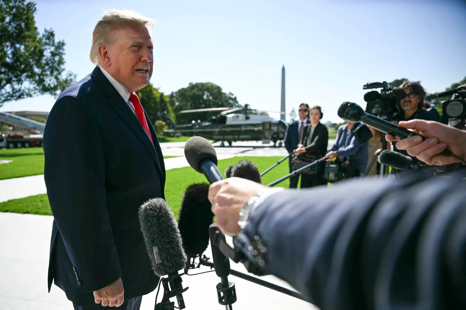 President Donald Trump talks to the media before boarding Marine One as he departs from the South Lawn of the White House in Washington, D.C., on October 13. (Photo by Jim WATSON/AFP via Getty Images)
