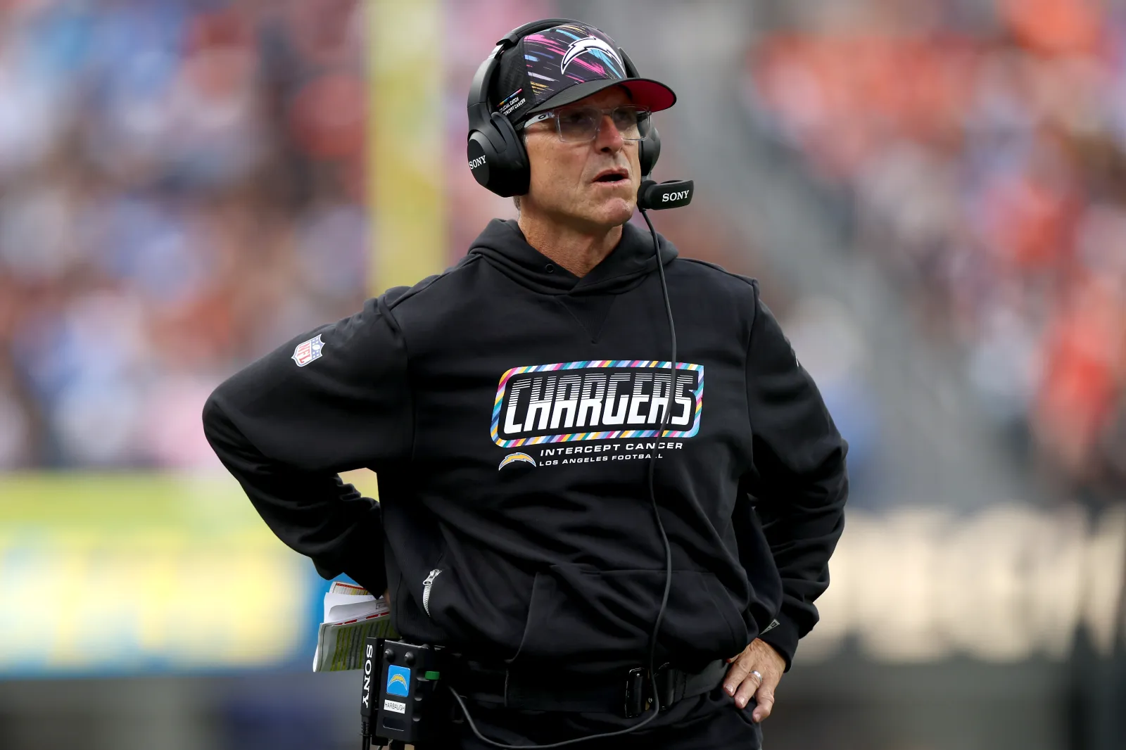 Chargers head coach Jim Harbaugh looks on during game against Broncos
