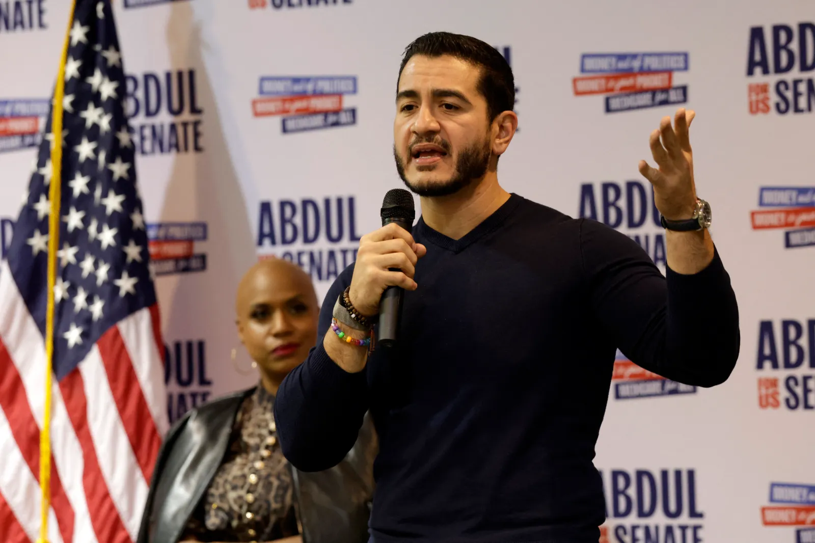 Abdul El-Sayed speaks on stage with US Representative Ayanna Pressley (L), Democrat of Massachusetts during a midterm campaign rally in Flint, Michigan on October 18, 2026.