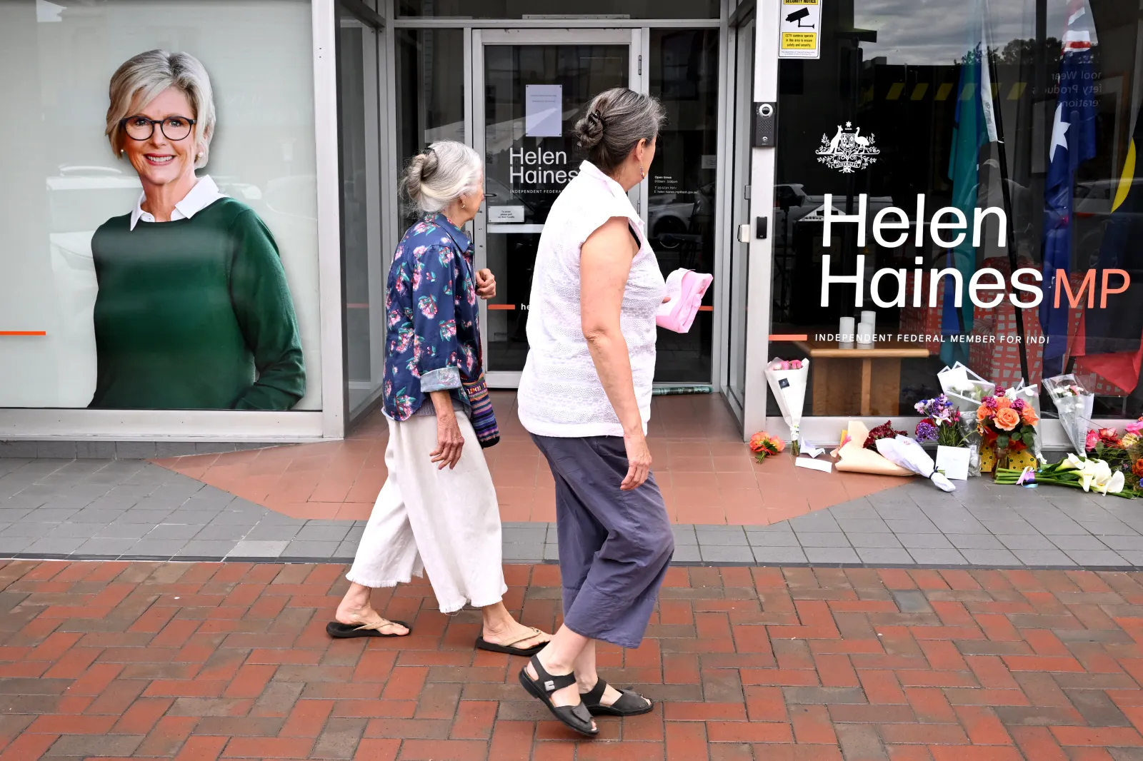 People lay flowers outside the office of Australian politician Helen Haines in the northern regional city of Wangaratta, 160 miles northeast of Melbourne, on October 20.
