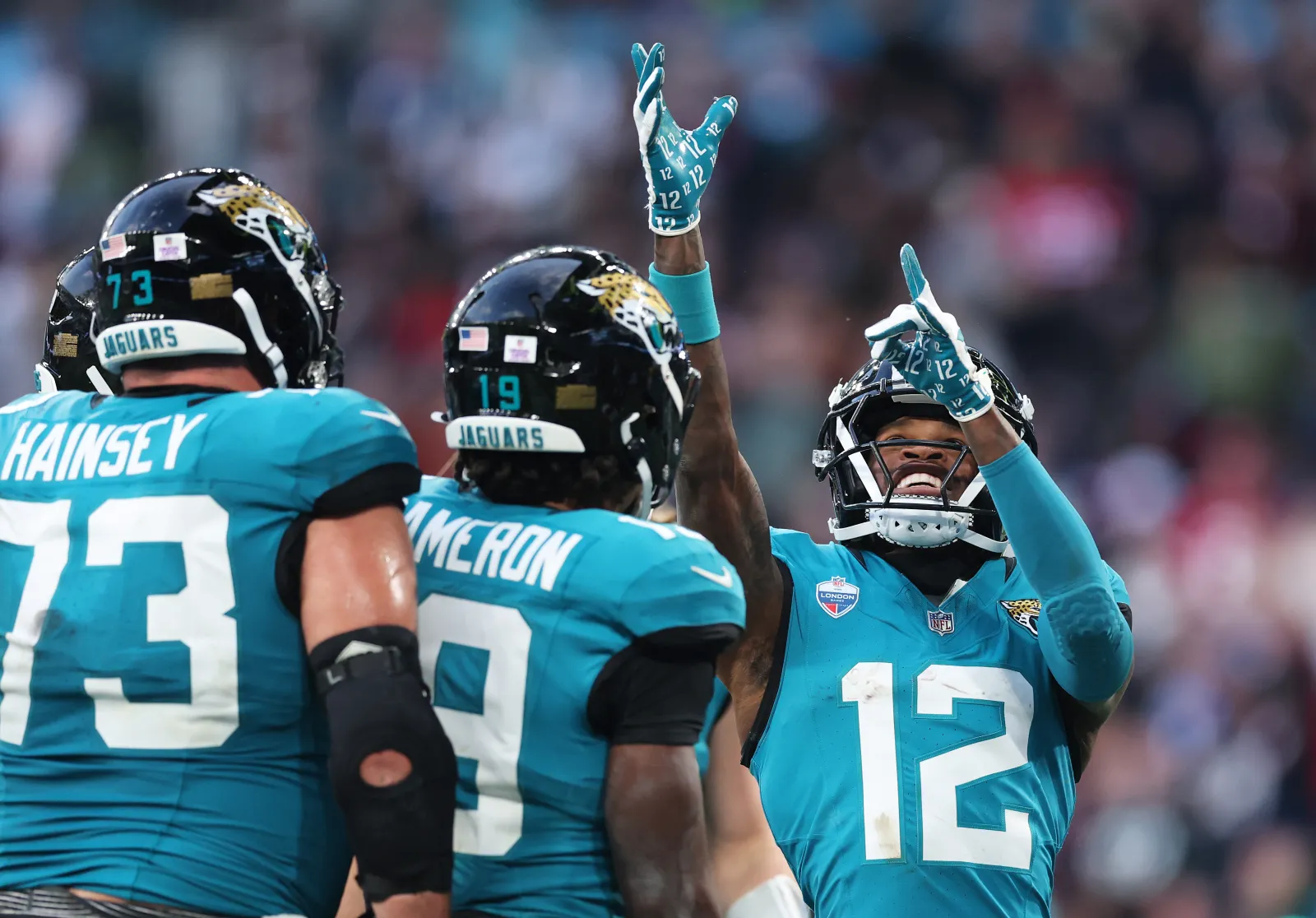 Jaguars receiver and cornerback Travis Hunter celebrates with teammates in London during game against Texans