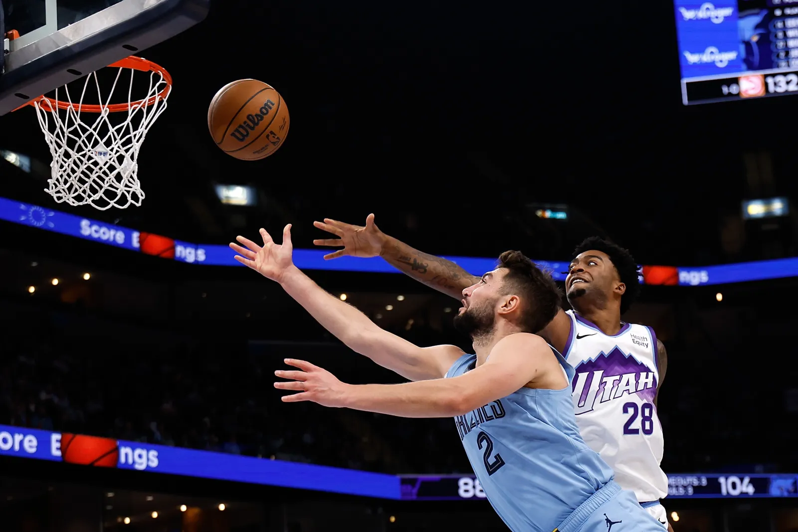Ty Jerome #2 of the Memphis Grizzlies goes to the basket against Brice Sensabaugh #28 of the Utah Jazz during the second half at FedExForum on Oct. 21, 2026 in Memphis, Tennessee.