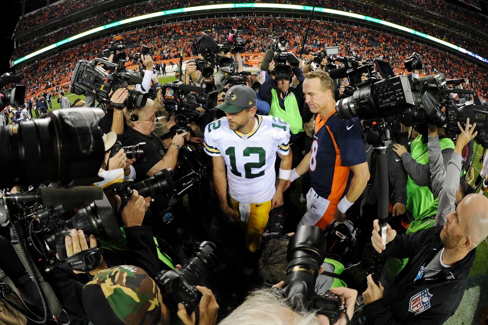 Media interviews Aaron Rodgers and Peyton Manning.