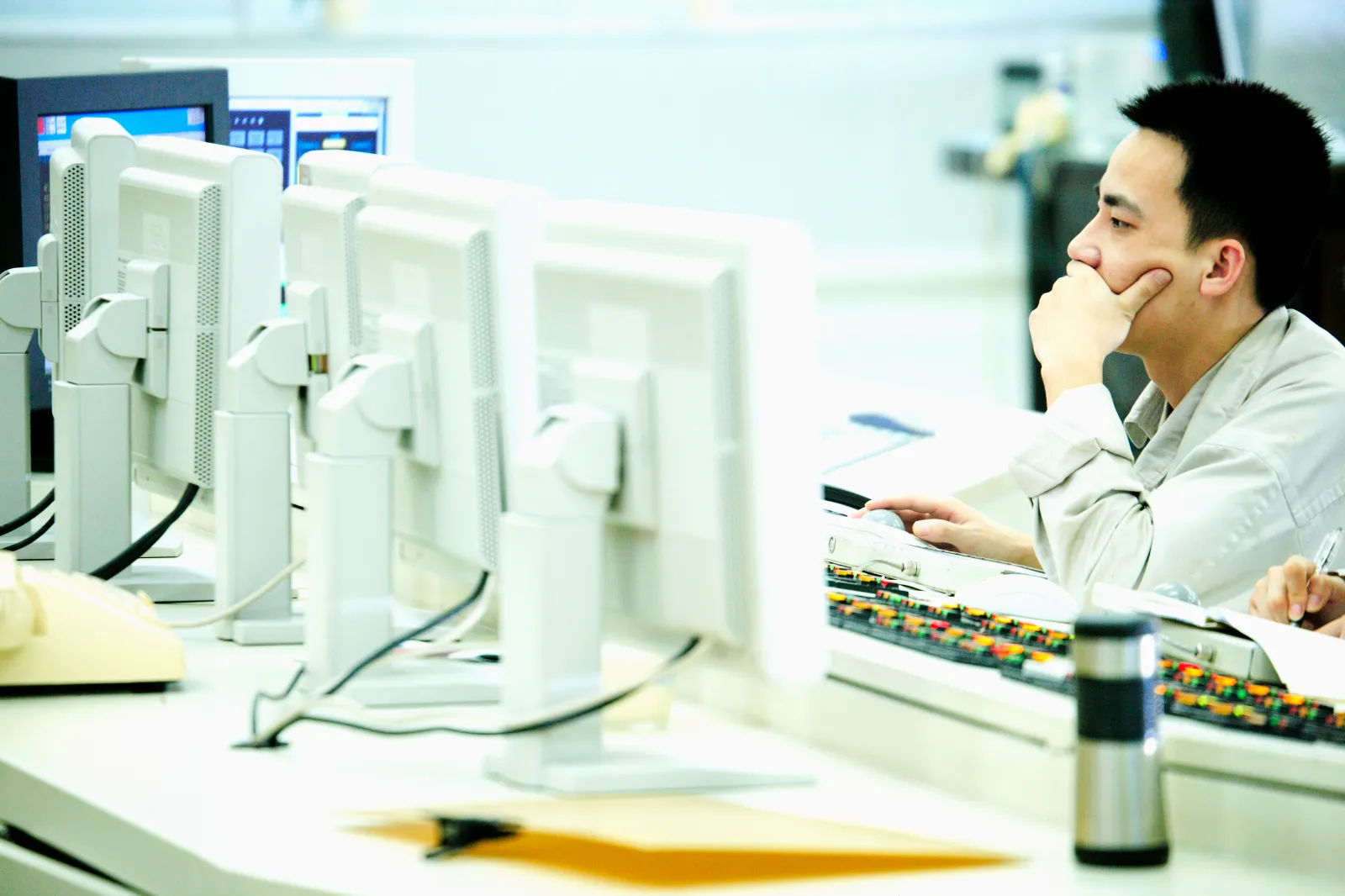 Undated stock image of a man sitting in front of the computer and concentrating on his work.