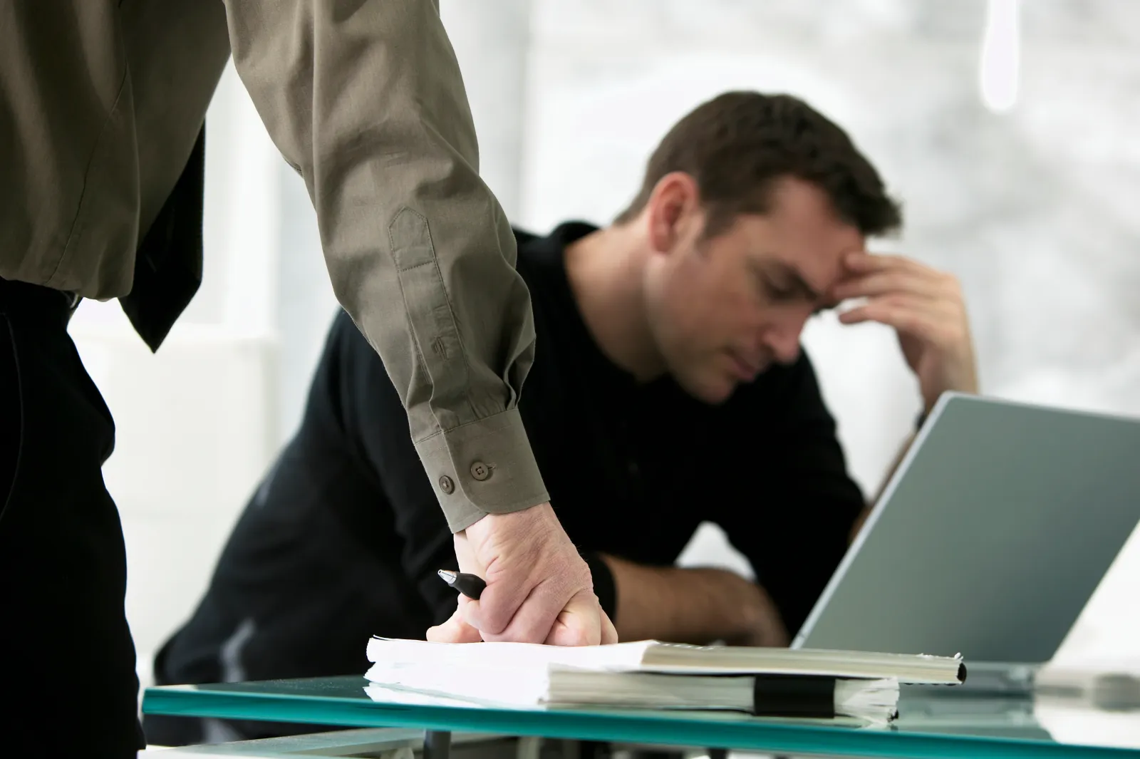 Undated stock image of two businessmen in a meeting.