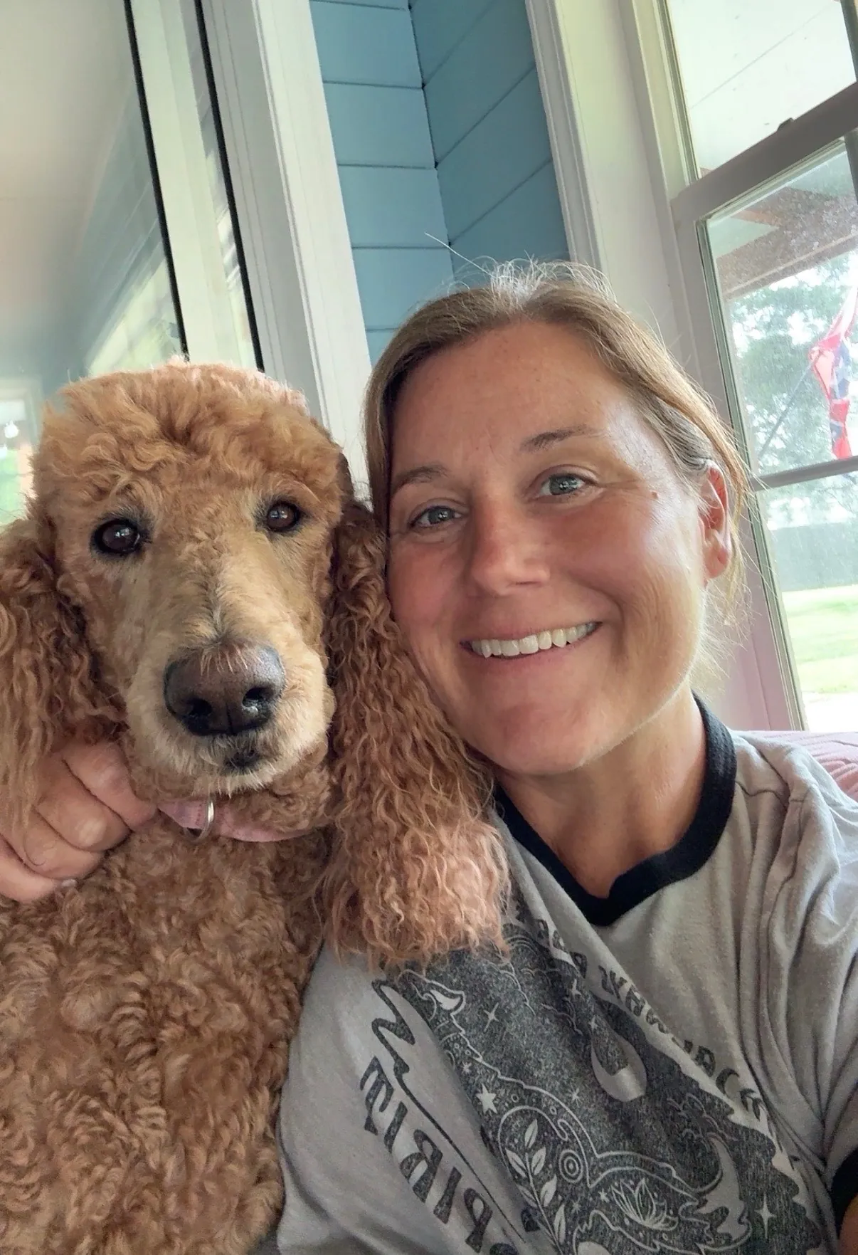 Morgan, seen here with one of her dogs, began sharing her story on social media to educate others about the early warning signs of colorectal cancer.