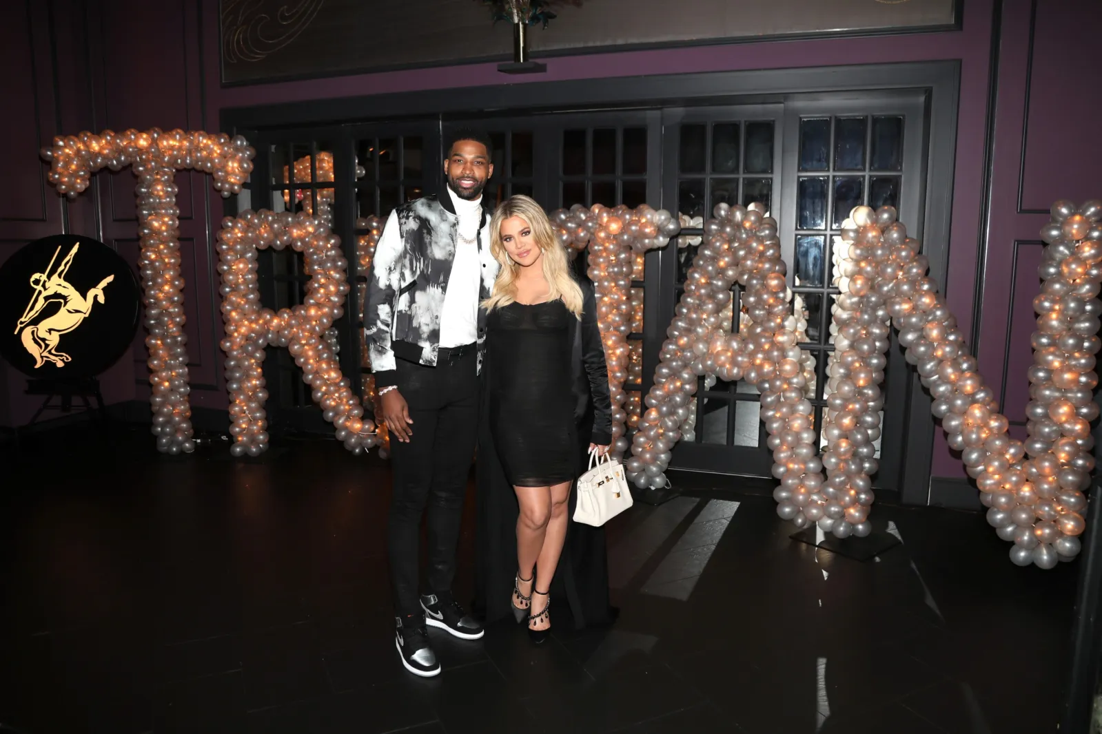 Tristan Thompson and then-pregnant Khloé Kardashian pose for a photo at his birthday celebration at Beauty & Essex on March 10, 2018 in Los Angeles, California.