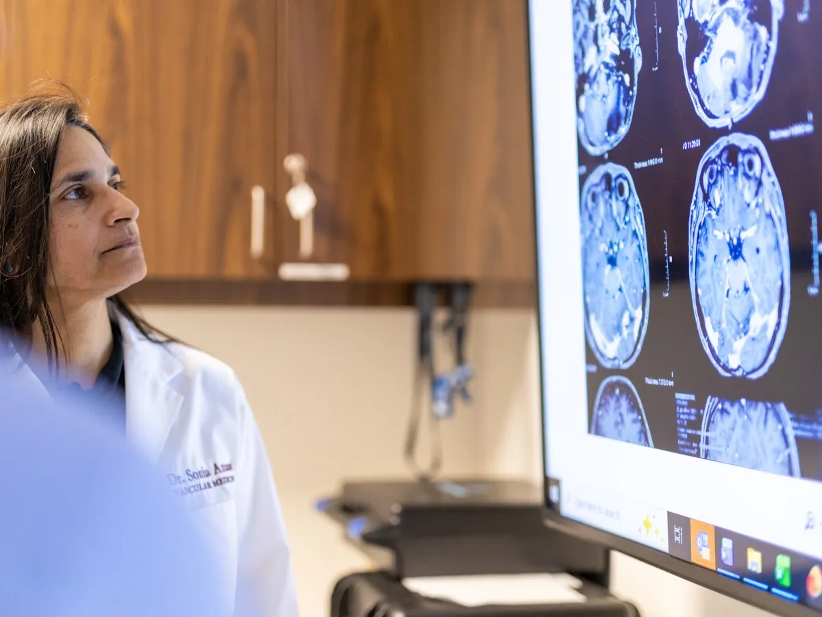 Anand reviews brain scans.