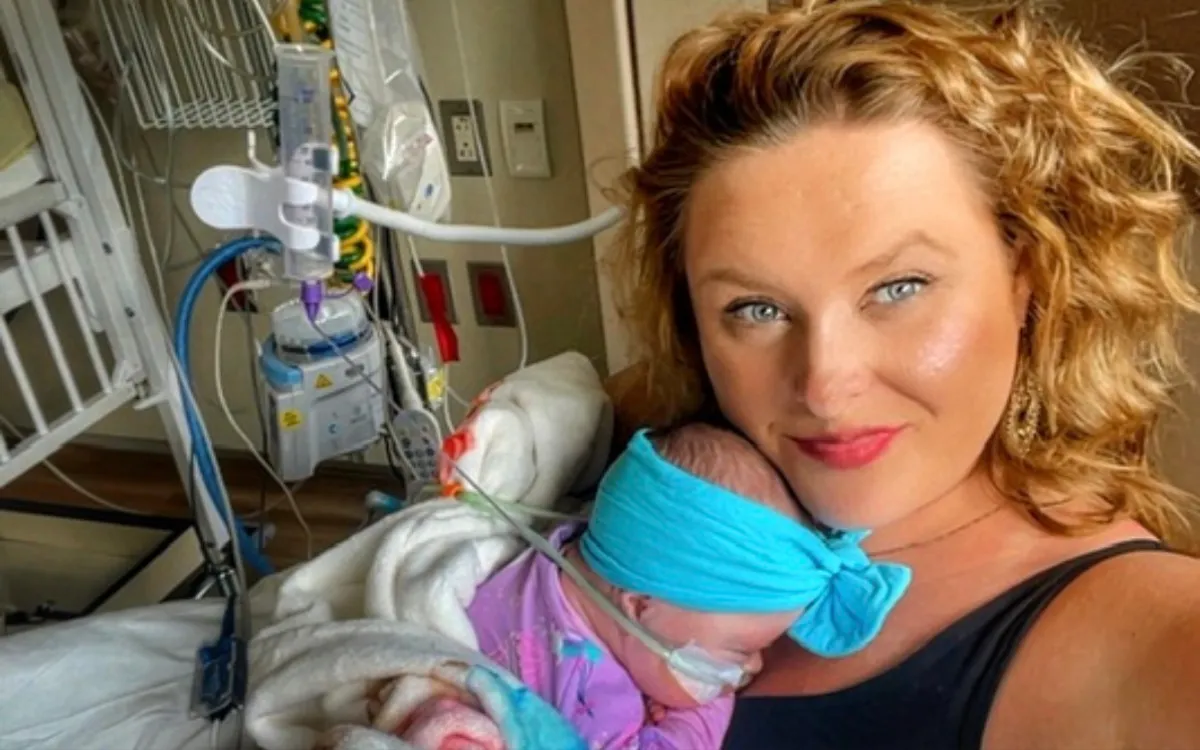Crystal holding Sonora in hospital.
