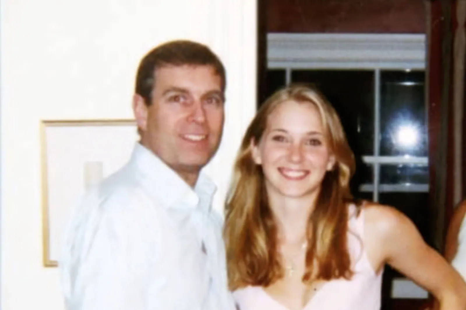 Andrew Mountbatten-Windsor is seen with his arm around Virginia Giuffre in an image included in her New York civil lawsuit against him. Giuffre said the image was taken at Ghislaine Maxwell's London townhouse in 2001 while Mountbatten-Windsor questioned its authenticity.
