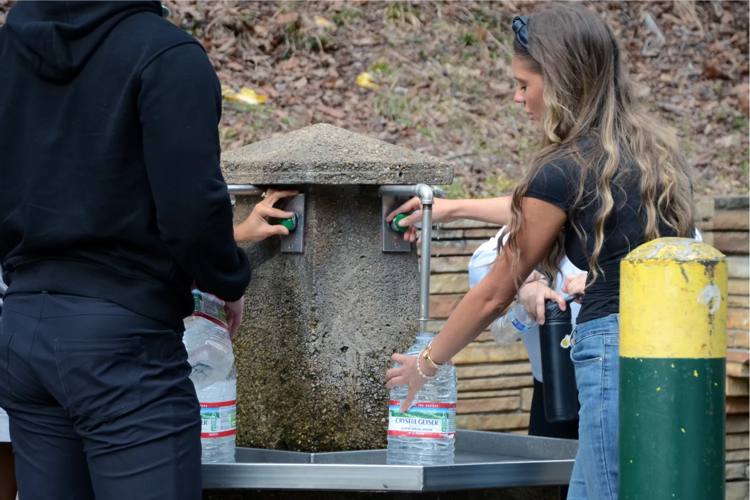 A file photo of people collecting drinking water from a spring.