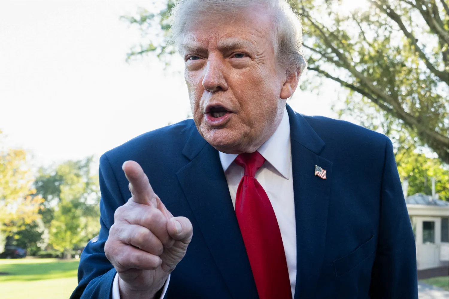 US President Donald Trump speaks to the media prior to departure on Marine One from the South Lawn of the White House in Washington, DC, October 21, 2026.